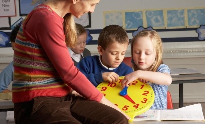 Image of children playing in the classroom