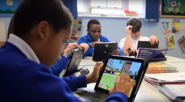 Children playing Sumdog in class